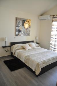a bedroom with a large bed in a room at Apartment Lara in Vodice