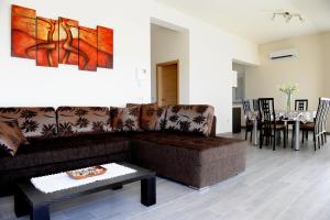 a living room with a couch and a table at Apartment Lara in Vodice