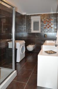 a bathroom with a toilet and a sink and a shower at Apartment Lara in Vodice