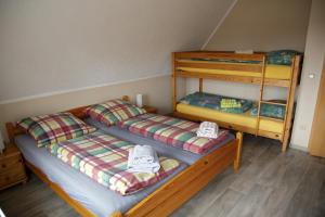 Postel nebo postele na pokoji v ubytování Gästehaus am Kirschberg