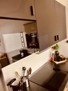 a kitchen counter with a sink and a mirror at Casa Relax in Playa Blanca