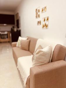 a living room with a couch and a television at Casa Relax in Playa Blanca