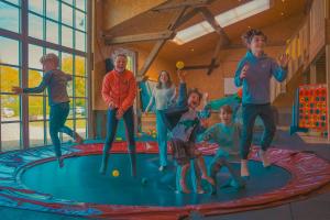 a group of children jumping on a trampoline at Himmelsbesen in Westermarkelsdorf