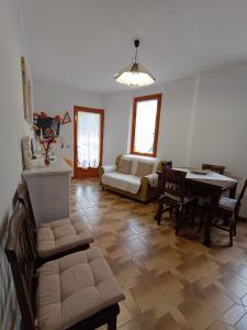 a living room with a couch and a table at Casa Crara in Cala Gonone