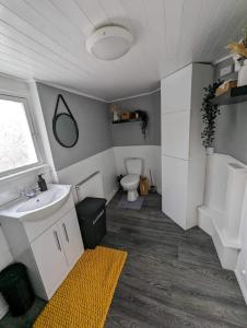 a bathroom with a sink and a toilet at Holiday home in City Centre in Liverpool