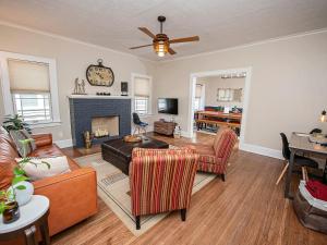 a living room with a couch and a fireplace at The Cherry St House/Great amenities/near MSU in Springfield