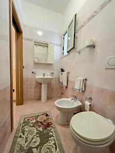 a bathroom with a toilet and a sink at B&B La Perla in Castro di Lecce