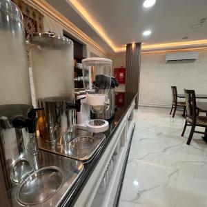 a kitchen with a counter with pots and pans at La Vie Boutique Hotel in Wadi Musa