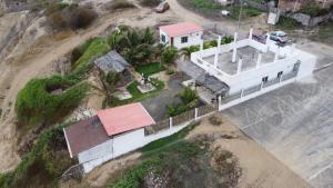 an aerial view of a house on top of a cliff at Estancia Spondylus in San Lorenzo