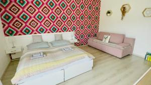 Postel nebo postele na pokoji v ubytování Joy Apartman