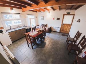 an overhead view of a kitchen with a table and chairs at La Posta Apart in Ushuaia