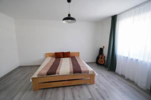 Postel nebo postele na pokoji v ubytování Vila Puha