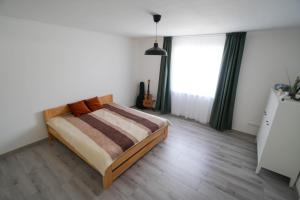 Postel nebo postele na pokoji v ubytování Vila Puha