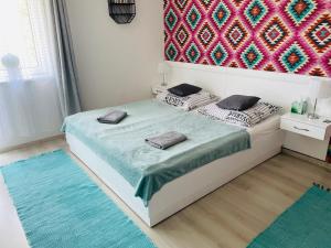 Postel nebo postele na pokoji v ubytování Joy Apartman