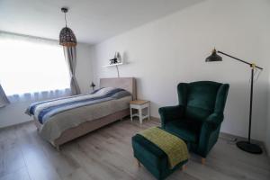Postel nebo postele na pokoji v ubytování Vila Puha