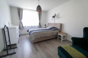 Postel nebo postele na pokoji v ubytování Vila Puha