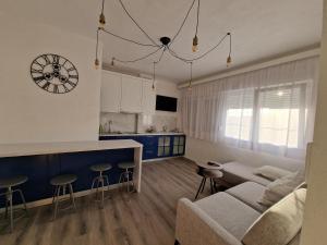 a living room with a couch and a table at Apartman Ivy in Ljubuški