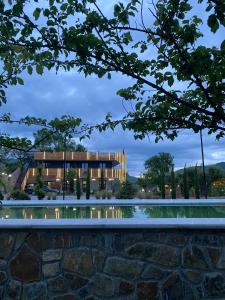 a rendering of a building with a pool at Hotel Restaurant Natyra e Qetë in Lezhë