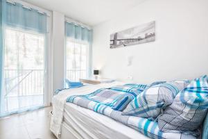 a bedroom with a bed and a window at Seaview Luxury 2 Bedrooms Apt in Reserva del Higueron in Benalmádena +26 photos