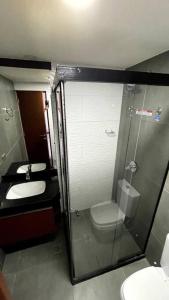 a bathroom with a shower and a toilet and a sink at Departamento 2 ambientes full amenities + Cochera in Santa Cruz de la Sierra