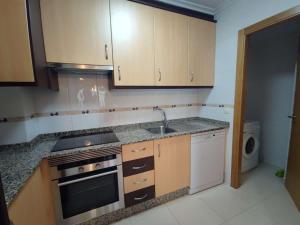 Η κουζίνα ή μικρή κουζίνα στο Barreiros Viladaide