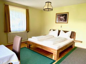 Ένα ή περισσότερα κρεβάτια σε δωμάτιο στο Pranger Hof