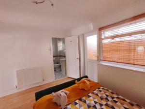 a bedroom with a bed with two stuffed animals on it at Fox hill view in Parkstone