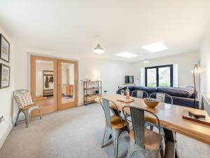 a living room with a table and chairs at Number 29 in Alnwick