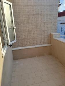 a bathroom with a shower with a window at DreamHouse Ischia-Lacco Ameno in pieno centro a soli 70 metri dal mare! in Ischia