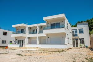an image of a large white house at Twins Apartment in Ulcinj