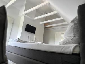 Postel nebo postele na pokoji v ubytování Kuestenbude Ahoi