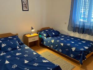 Postel nebo postele na pokoji v ubytování Apartment Kata