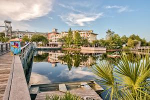 a view of a lake with buildings in the background at Villa Lago 1969 Baytowne Loop in Destin