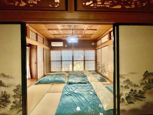 Voodi või voodid majutusasutuse T&T Fujiyama Guest House toas