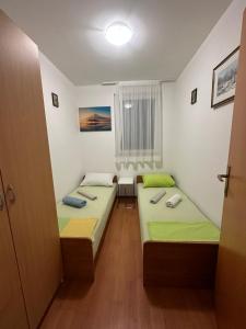 Ein Bett oder Betten in einem Zimmer der Unterkunft Apartment Ivek