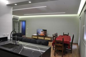 a living room with a couch and a table at City apartment 101 in Shkodër