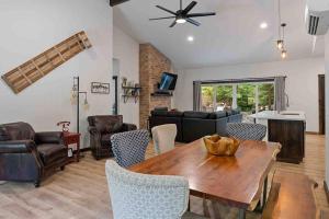 a living room with a wooden table and chairs at Luxe Mt. Rainier Lodge w/ Hot Tub-AC-Game Room in Ashford