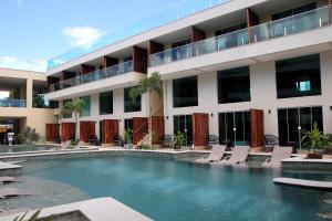 a hotel with a swimming pool in front of a building at Star Palace Hotel Jeri in Jericoacoara