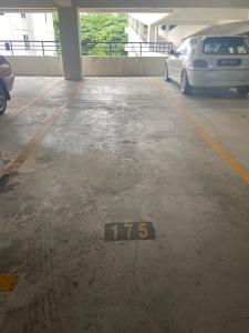a parking garage with a car parked in it at RS Homestay in Seri Kembangan
