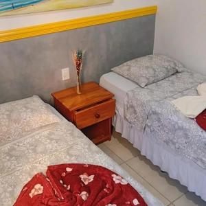 Cama o camas de una habitación en Casa1 Sua casa de férias perto das praias