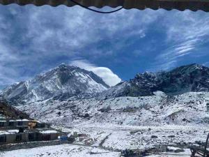 a view of a snow covered mountain range at Sherpa Lodge in Lobujya