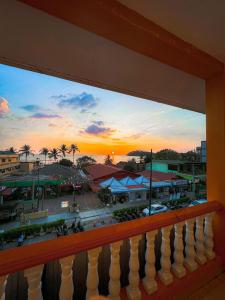 a view from a balcony of a town at sunset at Amzar Motel Cenang in Pantai Cenang
