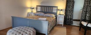 a bedroom with a large bed with two night stands at Old Mill in Slavsko Polje