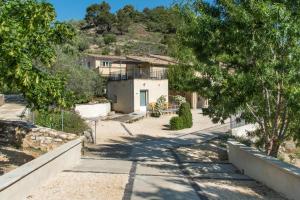 a house on the side of a hill at Domaine Saint Julien in Buis-les-Baronnies