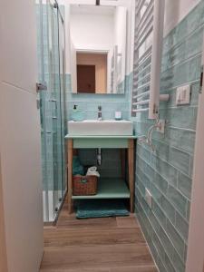 a bathroom with a sink and a mirror at Casa Porto Ercole in Porto Ercole +20 photos