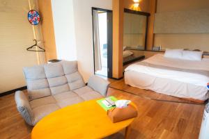 Postel nebo postele na pokoji v ubytování Hotel Lucia at Maebashi Akagi