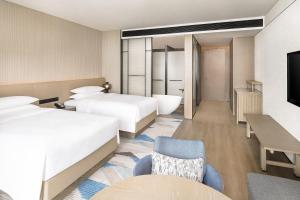 Postel nebo postele na pokoji v ubytování Sheraton Beihai Resort