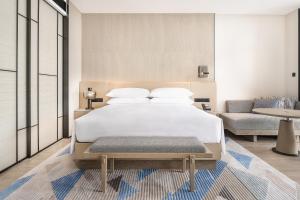 Postel nebo postele na pokoji v ubytování Sheraton Beihai Resort