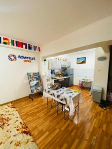 a room with two tables in a room with wooden floors at Adventure Riders Mongolia in Ulaanbaatar
