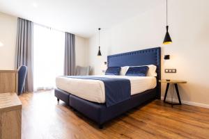 Taverna de la Sal Boutique Hotel客房内的一张或多张床位